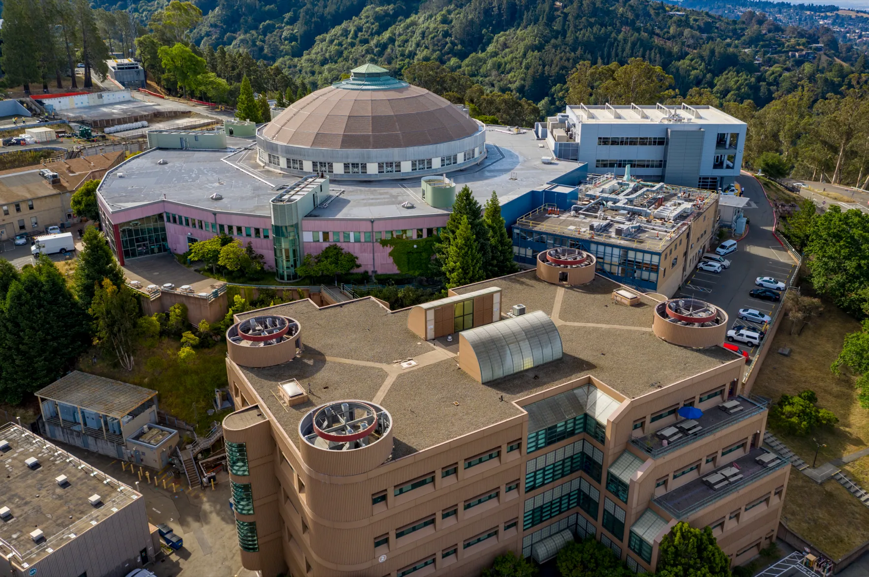 Aerial view of the Advanced Light Source dome (Building 6) and neighboring laboratory buildings on the hillside campus of Lawrence Berkeley National Laboratory in Berkeley, California